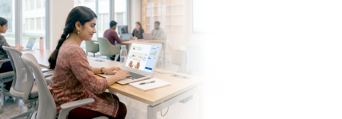 Woman typing on laptop in modern office